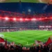 Estádio Emirates iluminado durante um jogo do Arsenal na Premier League em 2026.